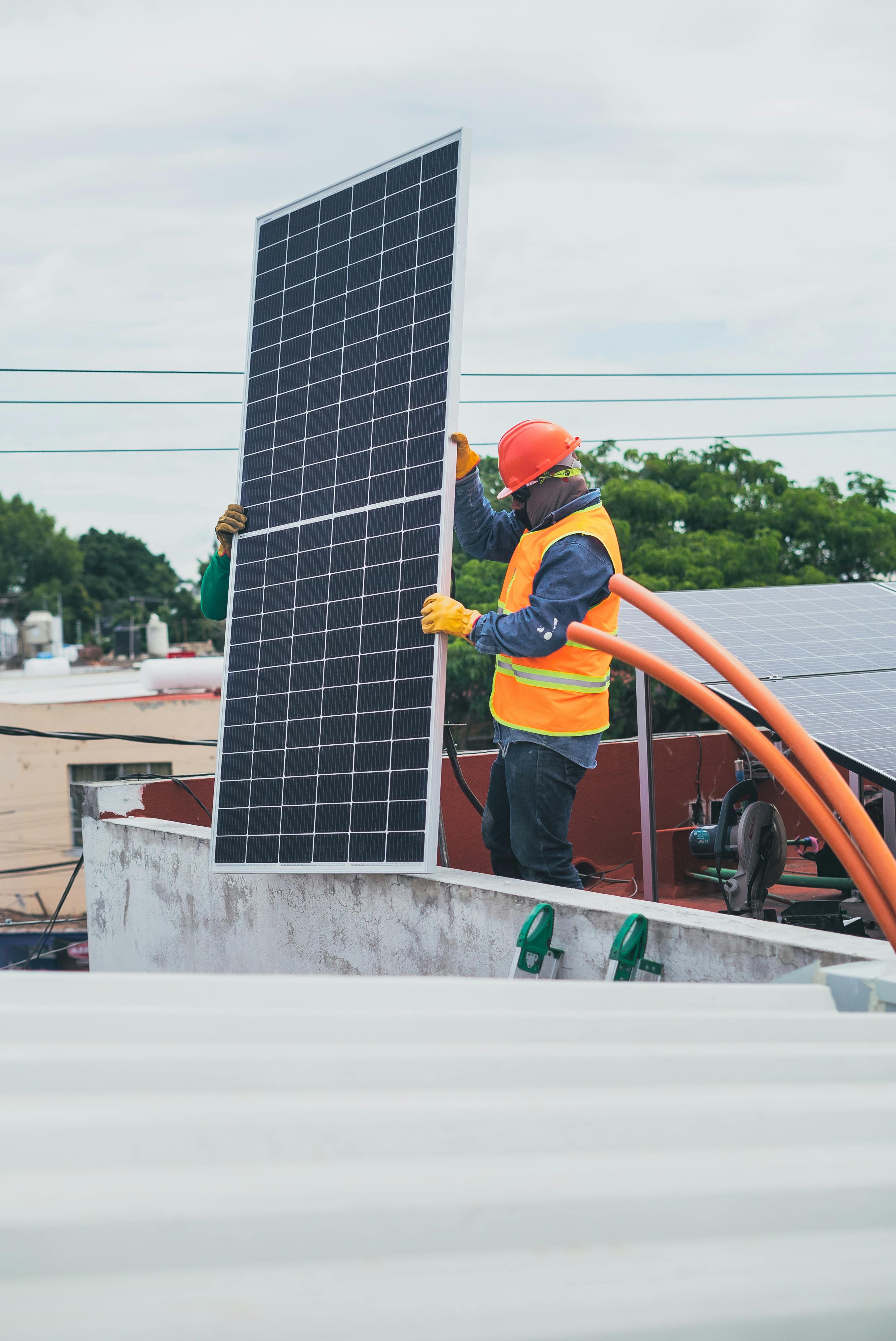 man installing solar panel